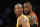FILE - In this March 10, 2016 file photo, Los Angeles Lakers' Kobe Bryant, left, and Cleveland Cavaliers' LeBron James wait for play to resume during the first half of an NBA basketball game in Los Angeles. For months, the Cavaliers' megastar has lived slightly under the radar, if that's even possible for one of the world's most famous and recognizable athletes. While Stephen Curry rained 3-pointers as the new face of the NBA, the Golden State Warriors hunted down history and Kobe Bryant took his final bows, James remained in the background awaiting his turn. (AP Photo/Danny Moloshok, File)