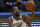 Brooklyn Nets forward Kevin Durant, top, shoots asGolden State Warriors forward Andrew Wiggins defends during the first half of an NBA basketball game in San Francisco, Saturday, Feb. 13, 2021. (AP Photo/Jeff Chiu)