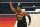 Utah Jazz guard Donovan Mitchell (45) directs his team as he runs upcourt in the second half during an NBA basketball game against the Miami Heat, Saturday, Feb. 13, 2021, in Salt Lake City. (AP Photo/Rick Bowmer)