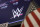 The logo for World Wrestling Entertainment, WWE, appears above a trading post on the floor of the New York Stock Exchange, Friday, Sept. 13, 2019. (AP Photo/Richard Drew)