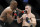 Kamaru Usman hits Colby Covington in a mixed martial arts welterweight championship bout at UFC 245, Saturday, Dec. 14, 2019, in Las Vegas. (AP Photo/John Locher)