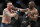 Kamaru Usman hits Colby Covington in a mixed martial arts welterweight championship bout at UFC 245, Saturday, Dec. 14, 2019, in Las Vegas. (AP Photo/John Locher)
