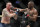Kamaru Usman hits Colby Covington in a mixed martial arts welterweight championship bout at UFC 245, Saturday, Dec. 14, 2019, in Las Vegas. (AP Photo/John Locher)