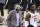 Alabama head coach Nate Oats walks across the court with John Petty Jr. (23) before an NCAA college basketball game against South Carolina Tuesday, Feb. 9, 2021, in Columbia, S.C. Alabama won 81-78. (AP Photo/Sean Rayford)