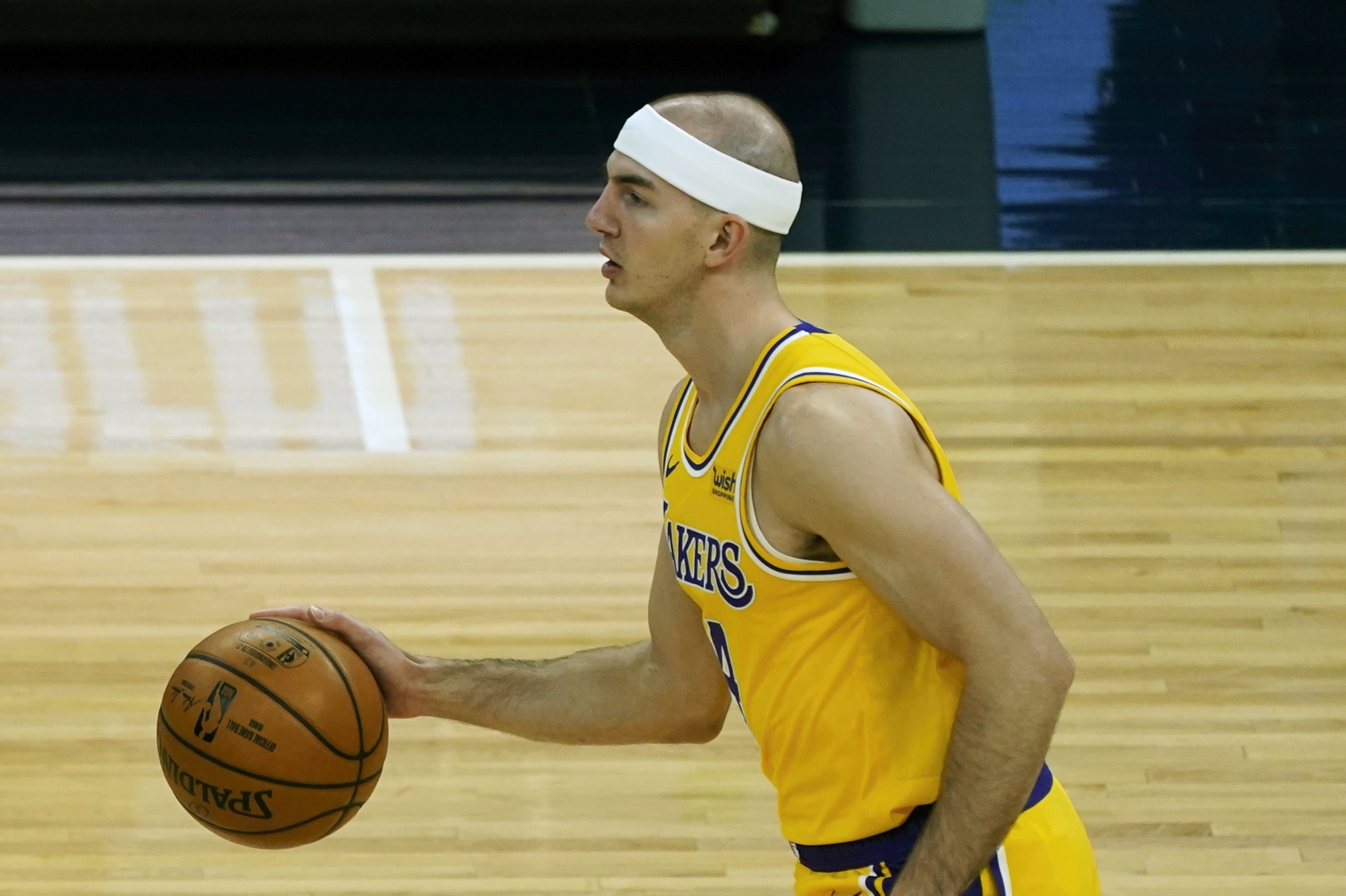 Los Angeles Lakers' Alex Caruso (4) plays in an NBA basketball game against the Minnesota Timberwolves, Tuesday, Feb. 16, 2021, in Minneapolis. (AP Photo/Jim Mone)
