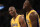 Los Angeles Lakers forward Kobe Bryant, left, talks with forward Julius Randle, right, during the second half of an NBA basketball game against the Memphis Grizzlies in Los Angeles, Tuesday, March 22, 2016. The Los Angeles Lakers won 107-100. (AP Photo/Kelvin Kuo)