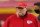 Kansas City Chiefs head coach Andy Reid wears a face shield as he watches players warm up before an NFL football game against the Houston Texans Thursday, Sept. 10, 2020, in Kansas City, Mo. (AP Photo/Charlie Riedel)