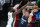 Dallas Mavericks guard Luka Doncic (77) looks to pass the ball as Boston Celtics guard Jaylen Brown (7) defends during the first half of an NBA basketball game in Dallas, Tuesday, Feb. 23, 2021. (AP Photo/Sam Hodde)