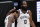 Brooklyn Nets guard Kyrie Irving, left, gets a pat on the head from guard James Harden during a timeout in the first half of the team's NBA basketball game against the Los Angeles Clippers on Sunday, Feb. 21, 2021, in Los Angeles. (AP Photo/Mark J. Terrill)