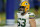Green Bay Packers center Corey Linsley (63) warms up before an NFL football game between the Indianapolis Colts and the Green Bay Packers, Sunday, Nov. 22, 2020, in Indianapolis. (AP Photo/Michael Conroy)