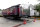 A trailer and a satellite truck to transmit wrestling broadcasts are parked outside the WWE Performance Center Tuesday, April 14, 2020, in Orlando, Fla.   Florida’s top emergency official last week amended Gov. Ron DeSantis’ stay-at-home order to include employees at the professional sports and media production with a national audience, if the location is closed to the public.  (AP Photo/John Raoux)