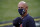 Atlanta Braves manager Brian Snitker lines up for the national anthem before Game 2 of a baseball National League Championship Series against the Los Angeles Dodgers Tuesday, Oct. 13, 2020, in Arlington, Texas. (AP Photo/Tony Gutierrez)