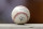A spring training baseball ball with a Cactus League logo sits on a dugout wall during a game between the Arizona Diamondbacks and Los Angeles Angels Thursday, March 21, 2019, in Scottsdale, Ariz. (AP Photo/Elaine Thompson)