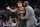 Atlanta Hawks coach Lloyd Pierce talks to guard Trae Young (11) on the sideline during the first half of the team's preseason NBA basketball game against the New York Knicks in New York, Wednesday, Oct. 16, 2019. (AP Photo/Kathy Willens)