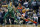 Washington Wizards' Bradley Beal (3) drives past Boston Celtics' Jayson Tatum (0) during the first quarter of an NBA basketball game in Boston, Monday, Dec. 25, 2017. (AP Photo/Michael Dwyer)