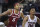 Arkansas guard Moses Moody (5) looks for a rebound against South Carolina guard AJ Lawson (00) during the second half of an NCAA college basketball game Tuesday, March 2, 2021, in Columbia, S.C. Arkansas won 101-73. (AP Photo/Sean Rayford)