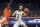 Virginia guard Kihei Clark (0) passes the ball around Miami center Nysier Brooks (3) during an NCAA college basketball game, Monday, March 1, 2021, in Charlottesville, Va. (Andrew Shurtleff/The Daily Progress via AP, Pool)