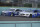 Brad Keselowski (2) and Chris Buescher (17) battle for position during a NASCAR Cup Series auto race, Sunday, Feb. 28, 2021, in Homestead, Fla. (AP Photo/Wilfredo Lee)