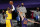 Los Angeles Lakers forward LeBron James, left, shoots as Phoenix Suns forward Dario Saric defends during the first half of an NBA basketball game Tuesday, March 2, 2021, in Los Angeles. (AP Photo/Mark J. Terrill)
