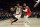 Los Angeles Clippers' Paul George (13) dribbles past Portland Trail Blazers' Damian Lillard (0) during the second half of an NBA basketball game Tuesday, Dec. 3, 2019, in Los Angeles. (AP Photo/Marcio Jose Sanchez)