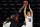 Northwestern forward Miller Kopp, right, shoots against Maryland guard Darryl Morsell during the second half of an NCAA college basketball game in Evanston, Ill., Wednesday, March 3, 2021. Northwestern won 60-55. (AP Photo/Nam Y. Huh)