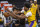 Los Angeles Lakers center Damian Jones (30) fights for the ball against Sacramento Kings guard De'Aaron Fox (5) as teammate Marvin Bagley III (35) assists on defense during the second quarter of an NBA basketball game in Sacramento, Calif., Wednesday, March 3, 2021. (AP Photo/Hector Amezcua)
