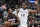 Miami Heat's Jimmy Butler (22) drives around San Antonio Spurs' LaMarcus Aldridge during the first half of an NBA basketball game, Sunday, Jan. 19, 2020, in San Antonio. (AP Photo/Darren Abate)