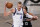 Dallas Mavericks center Kristaps Porzingis (6) is defended by Brooklyn Nets guard James Harden (13) during the first half of an NBA basketball game Saturday, Feb. 27, 2021, in New York. (AP Photo/John Minchillo)