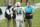 Miami Dolphins quarterback Ryan Fitzpatrick (14) talks to head coach Brian Flores during the first half of an NFL football game against the New York Jets, Sunday, Oct. 18, 2020, in Miami Gardens, Fla. (AP Photo/Wilfredo Lee)