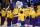 The Los Angeles Lakers interact after player introductions before the start of an NBA basketball game against the Brooklyn Nets Thursday, Feb. 18, 2021, in Los Angeles. (AP Photo/Marcio Jose Sanchez)