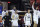 The Utah State bench reacts during the second half of an NCAA college basketball game against Colorado State in the semifinal round of the Mountain West Conference men's tournament Friday, March 12, 2021, in Las Vegas. (AP Photo/Isaac Brekken)