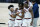 Illinois' Andre Curbelo, left, Ayo Dosunmu, center and Kofi Cockburn (21) hug as they leave the court following an 82-71 win over Iowa in an NCAA college basketball game at the Big Ten Conference tournament in Indianapolis, Saturday, March 13, 2021. (AP Photo/Michael Conroy)