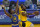 Los Angeles Lakers forward LeBron James, right, shoots against Golden State Warriors center James Wiseman (33) during the first half of an NBA basketball game in San Francisco, Monday, March 15, 2021. (AP Photo/Jeff Chiu)