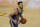 Golden State Warriors guard Stephen Curry (30) dribbles the ball up the court against the Los Angeles Lakers during the second half of an NBA basketball game in San Francisco, Monday, March 15, 2021. (AP Photo/Jeff Chiu)