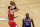 Chicago Bulls guard Zach LaVine, left, shoots as Philadelphia 76ers guard Shake Milton watches during the first half of an NBA basketball game in Chicago, Thursday, March 11, 2021. (AP Photo/Nam Y. Huh)