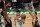 Boston Celtics forward Jayson Tatum, center, looks to pass the ball while pressured by Utah Jazz center Donovan Mitchell, left, and forward Bojan Bogdanovic, right, during the first half of an NBA basketball game, Tuesday, March 16, 2021, in Boston. (AP Photo/Charles Krupa)