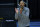 Michigan head coach Juwan Howard on the bench in the first half of an NCAA college basketball game against Ohio State at the Big Ten Conference tournament in Indianapolis, Saturday, March 13, 2021. (AP Photo/Michael Conroy)