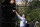 President Barack Obama shoots a basketball during the annual Easter Egg Roll at the White House in Washington, Monday, April 5, 2010. (AP Photo/Alex Brandon)