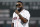 Former Boston Red Sox's David Ortiz address the crowd after throwing out the ceremonial first pitch before a baseball game against the New York Yankees in Boston, Monday, Sept. 9, 2019. (AP Photo/Michael Dwyer)