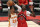 Atlanta Hawks' John Collins, left, shoots against Toronto Raptors' Chris Boucher during the first half of an NBA basketball game Thursday, March 11, 2021, in Tampa, Fla. (AP Photo/Mike Carlson)