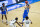UCLA's Jaime Jaquez Jr. (4) shoots a 3-pointer near teammate David Singleton (34) and in front of Michigan State's Rocket Watts (2) and Gabe Brown (44) during the first half of a First Four game in the NCAA men's college basketball tournament, Thursday, March 18, 2021, at Mackey Arena in West Lafayette, Ind. (AP Photo/Robert Franklin)