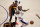 CORRECTS HAWKS PLAYER AT BOTTOM TO SOLOMON HILL, INSTEAD OF TONY SNELL - Los Angeles Lakers forward LeBron James, center, grimaces as he trips and injures himself over Atlanta Hawks forward Solomon Hill, bottom, during the first half of an NBA basketball game Saturday, March 20, 2021, in Los Angeles. (AP Photo/Marcio Jose Sanchez)