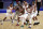 New York Knicks forward Reggie Bullock is mobbed by teammates after taking the ball away from the Orlando Magic in the final seconds of an NBA basketball game Thursday, March 18, 2021, in New York. The Knicks won 94-93. (AP Photo/Adam Hunger, Pool)