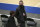 Brooklyn Nets general manager Sean Marks, right, talks to Ryan Gisriel, director of basketball operations, as they walk near the court as players warm up for an NBA basketball game against the New York Knicks on Wednesday, Jan. 13, 2021, in New York. (Brad Penner/Pool Photo via AP)