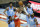 Oklahoma City Thunder center Moses Brown, middle, reaches for a rebound between, from left, Houston Rockets guard Victor Oladipo (7) center Christian Wood (35), forward Danuel House Jr. (4) and guard John Wall (1) during the second half of an NBA basketball game Sunday, March 21, 2021, in Houston. (AP Photo/Michael Wyke)