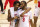 Houston guard Tramon Mark (12), left, and guard DeJon Jarreau (3) walk off the court after defeating Cleveland State in a first-round game in the NCAA men's college basketball tournament, Friday, March 19, 2021, at Assembly Hall in Bloomington, Ind. (AP Photo/Doug McSchooler)