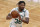 Boston Celtics' Marcus Smart plays against the Orlando Magic during the first half on an NBA basketball game, Sunday, March 21, 2021, in Boston. (AP Photo/Michael Dwyer)