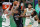 Boston Celtics' Daniel Theis (27) and Semi Ojeleye (37) defend against Orlando Magic's Aaron Gordon (00) during the first half on an NBA basketball game, Sunday, March 21, 2021, in Boston. (AP Photo/Michael Dwyer)