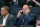 FILE - In this March 2, 2020, file photo, New York Knicks president Leon Rose, center, takes a phone call during the first quarter of an NBA basketball game against the Houston Rockets in New York. Rose didn't have much time to evaluate the Knicks after becoming team president in March. But with their season officially over, he can begin making changes after another losing season. (AP Photo/Kathy Willens, File)