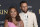 NBA player Stephen Curry, of the Golden State Warriors, back right, Ayesha Curry, back left, and their children, from front row left, Ryan and Riley, arrive at the world premiere of